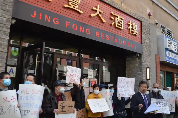 Community organizer Don Lee (far right)  and a group of workers and community organizers rally outside Jing Fong banquet hall on Elizabeth Street to propose a plan to take over the lease and create a collectively-owned restaurant.